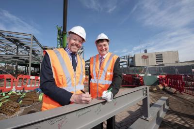 (l-r): Malcolm Holmes, TfWM Director of Rail (part of WMCA) and Cllr John Reynolds, City of Wolverhampton Council sign the steel