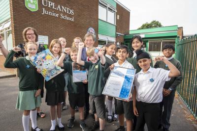 Pupils celebrating after winning the UNICEF Rights Respecting School Award with Councillor Dr Michael Hardacre, the City of Wolverhampton Council's Cabinet Member for Education and Skills, and Sarah Lane, Rights Reception Lead Teacher