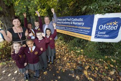 Headteacher Jenny Byrne, Cabinet Member for Education and Skills Councillor Dr Michael Hardacre and pupils celebrate SS Peter and Paul Catholic Primary Academy’s Good rating