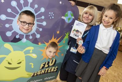 Berrybrook Primary School pupils Finley Johnson, Harlow McInnis and Courtland Skitt become Flu Fighters after receiving their nasal spray from Vaccination UK nurse Helen Burrell