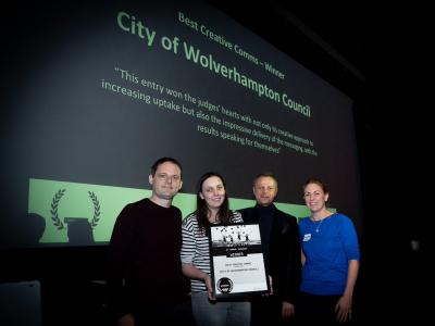 The City of Wolverhampton Council's Communications Manager Paul Brown and Digital Communications Officer Stacey Hinton collect the UnAward for Best Creative Comms from Darren Caveney of comms2point0 and Caroline Roodhouse from Alive with Ideas