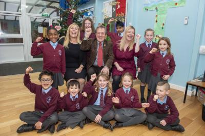 Councillor Dr Michael Hardacre, Cabinet Member for Education and Skills, celebrates with children and Executive Headteacher Katy Kent and Headteacher Rachael Kilmister from St Bartholomew's C of E Primary School which was included in the Sunday Times Parent Power guide as one of the country's best primary schools
