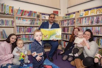 Councillor Harman Banger, the City of Wolverhampton Council's Cabinet Member for City Economy, is joined by Library and Information Assistant Adrienne Withers and April Turner and Kate Semilia and their children at the refurbished Finchfield Library