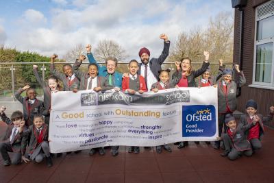 Celebrating Nishkam Primary School's Good Ofsted rating are pupils with Councillor Dr Michael Hardacre, Cabinet Member for Education and Skills, Headteacher Harmander Singh Dhanjal and Debbie Westwood, the Director of Primary Education for Nishkam School Trust