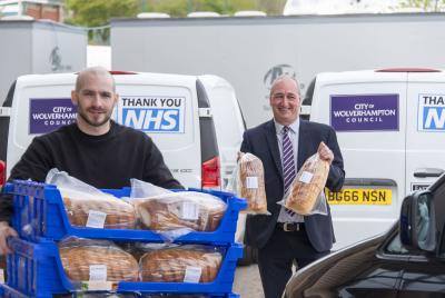 (LtoR) Baker James Price with Councillor Steve Evans delivering fresh bread to the city's emergency food distribution hub