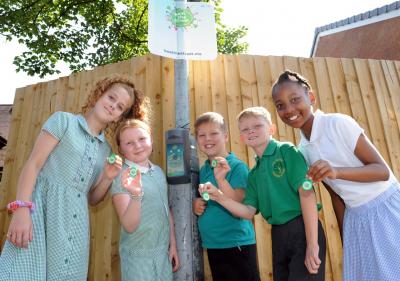 Fallings Park Primary School pupils Layla Brain, Taylor-Sky Westwood, Caleb Blakemore, George Rowton and Rochee Gordon hold their game fobs next to a Beat Box