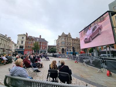 People watch the State Funeral of Her Majesty Queen Elizabeth II on a big screen in Queen Square, Wolverhampton