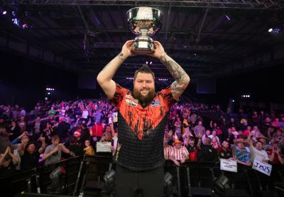 Michael Smith lifts last year’s Grand Slam of Darts trophy at WV Active Aldersley