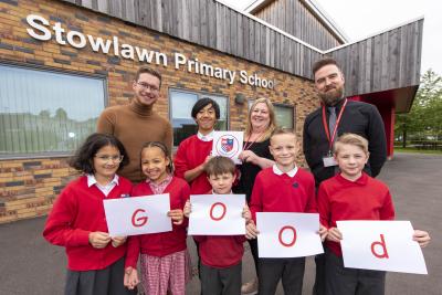 Pupils join Councillor Chris Burden, the City of Wolverhampton Council's Cabinet Member for Children, Young People and Education, Headteacher Kate Charles and Deputy Headteacher James O'Connor to celebrate Stowlawn Primary School's Good Ofsted rating