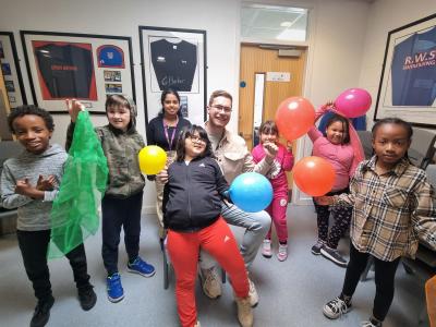Councillor Christopher Burden, Cabinet Member for Children and Young People and Maya Patel, #YES Youth Inspector, with children attending the STRiVE Plus provision, a provision for SEND children, held at The Hilda Hayward swimming pool at The Royal School, over May half term