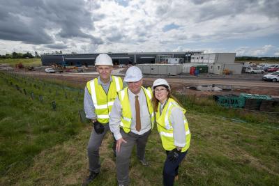 (L-R): Fortune Brands Innovations General Manager, Steve Geary, City of Wolverhampton Council Deputy Leader and Cabinet Member for Inclusive City Economy, Councillor Stephen Simkins, and South Staffordshire Council Deputy Leader, Councillor Victoria Wilson, on site at Fortune Brands Innovations new i54 western extension development