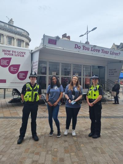 Representatives from Recovery Near You and Wolverhampton Police with the Love Your Liver Bus in Queen Square
