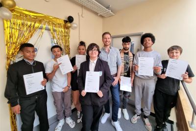 Councillor Chris Burden, the City of Wolverhampton Council's Cabinet Member for Children, Young People and Education, with some of the young people who have completed their ASDAN courses