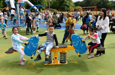 Children and young people enjoying the new play area and splash pad at East Park