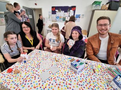 Sarah Baker, Chair at Voice4Parents and Councillor Chris Burden, Cabinet Member for Children, Young People and Education, with families and children enjoying a Coffee, Chat and Crafts session at Low Hill Strengthening Families Hub