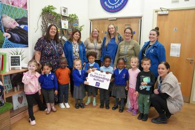 Children are celebrating Low Hill Nursery's Outstanding Ofsted judgment. They are pictured with, left to right, Natalie Showell, Headteacher, Runak Hamad, UQT, Emma Harris, SENCO, Hayley Tipple, Early Years Practitioner, Tara Smith, Pastoral Support, Toni Jones, Early Years Practitioner, and Samantha Phillips, Pastoral Support