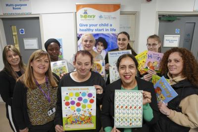 At the HENRY programme session at Low Hill Family Hub are, back, left to right, Leanne Whild, Family Learning Support Worker; Khadijat Okanlawon, parent; Leanne Cottam, Parent; Letisha Russell, parent and Beth Anne Rides, parent; and front, left to right, Kelly Murror, Family Learning Support Worker; Samantha Gilliver, parent; Councillor Jasbir Jaspal, Cabinet Member for Adults and Wellbeing, and Elishia Miller, parent