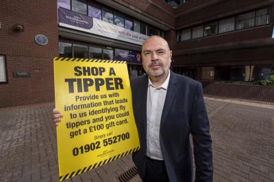 Councillor Craig Collingswood, cabinet member for environment and climate change at City of Wolverhampton Council, with contact details for the Shop a Tipper scheme