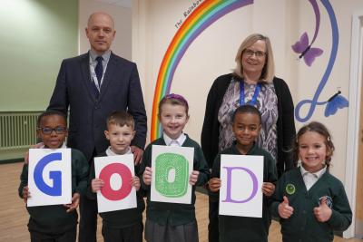 Headteacher Aidan Edmunds and Deputy Headteacher Emma Guest celebrate Westacre Infant School's Good Ofsted rating with pupils