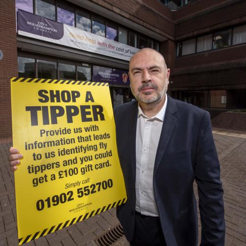 Councillor Craig Collingswood, cabinet member for environment and climate change at City of Wolverhampton Council, with details of the Shop a Tipper scheme