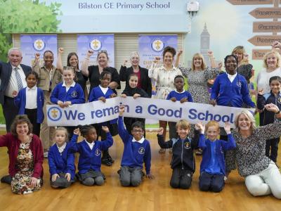 Headteacher Gary Gentle, staff and pupils celebrate Bilston Church of England Primary School’s Good Ofsted report with Councillor Jacqui Coogan, the City of Wolverhampton Council's Cabinet Member for Children, Young People and Education