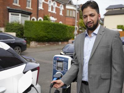 Councillor Qaiser Azeem, City of Wolverhampton Council cabinet member for transport and green city, with one of the first on street charging points in Merridale Crescent, Wolverhampton