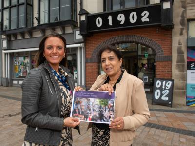 Councillor Jasbir Jaspal, the City of Wolverhampton Council’s Cabinet Member for Adults and Wellbeing, and Clare Dickens MBE, Chair of Wolverhampton’s Suicide Prevention Stakeholder Forum, with a copy of the City of Wolverhampton Suicide Prevention Strategy