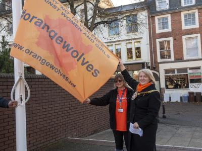 The Mayor Councillor Linda Leach raises the Orange Wolverhampton flag