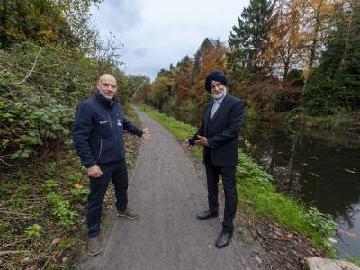 Welcoming visitors to the improved canal towpath at Smestow Valley are Councillor Bhupinder Gakhal, cabinet member for resident services at City of Wolverhampton Council, and Ian Lane, Head of Operational Partnerships and Fundraising at Canal & River Trust