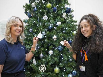 With the WV Active Giving Tree at Bilston-Bert Williams are, left, Lisa Johnson, Sales and Services Manager, and right, Jessica Savage, Active Ageing Coordinator