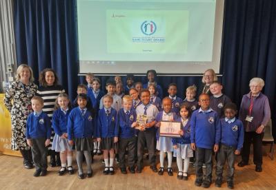 Staff and pupils celebrate the award