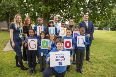 Teachers and pupils from Grove Primary Academy celebrate their Good Ofsted rating with teachers Danielle Burgoyne and Lucy Trainer, Headteacher Philip Salisbury, and Assistant Headteachers Christine Ivory and Zac Price