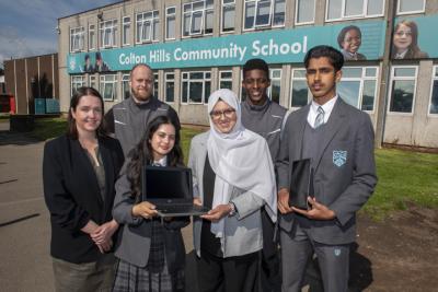 Back from left, James Kennedy and Gareth Williams, both from REPC Ltd.  Front from left, Colton Hills Community School headteacher Julie Hunter, Year 7 pupil Shreya, aged 12, Councillor Obaida Ahmed, Cabinet Member for Digital and Community at City of Wolverhampton Council and Year 10 pupil Shawaiz, aged 15