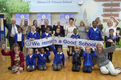 Headteacher Gary Gentle, staff and pupils celebrate Bilston Church of England Primary School’s Good Ofsted report with Councillor Jacqui Coogan, the City of Wolverhampton Council's Cabinet Member for Children, Young People and Education