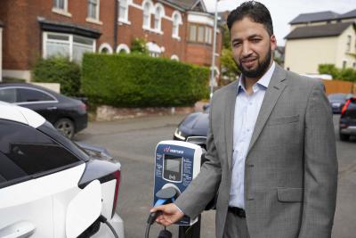 Councillor Qaiser Azeem, City of Wolverhampton Council cabinet member for transport and green city, with one of the first on street charging points in Merridale Crescent, Wolverhampton