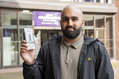 Amrik Sangha, a Health Improvement Officer with the City of Wolverhampton Council, with one of the vape kits that are available to people who want to Swap to Stop smoking