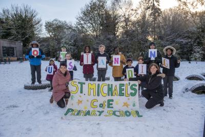 Children from St Michael’s Church of England Aided Primary School celebrate their Outstanding inspection report with Headteacher Kate Jackson and Deputy Headteacher Helen-Marie Navratil