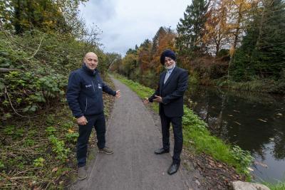 Welcoming visitors to the improved canal towpath at Smestow Valley are Councillor Bhupinder Gakhal, cabinet member for resident services at City of Wolverhampton Council, and Ian Lane, Head of Operational Partnerships and Fundraising at Canal & River Trust