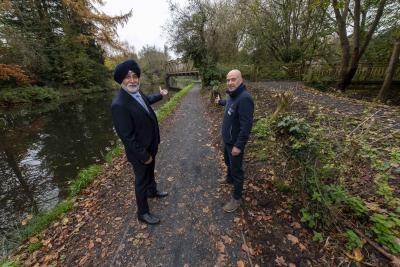 Welcoming visitors to the improved canal towpath at Smestow Valley are Councillor Bhupinder Gakhal, cabinet member for resident services at City of Wolverhampton Council, and Ian Lane, Head of Operational Partnerships and Fundraising at Canal & River Trust