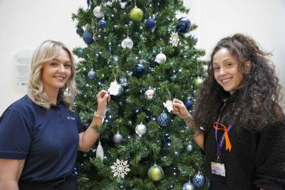 With the WV Active Giving Tree at Bilston-Bert Williams are, left, Lisa Johnson, Sales and Services Manager, and right, Jessica Savage, Active Ageing Coordinator