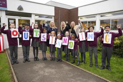 Celebrating St Bartholomew’s Church of England Primary School's outstanding report are pupils with, left to right, Katy Kent, CEO of St Bartholomew’s CE Multi Academy Trust, Rachael Kilmister, Headteacher, and Steph Banks, Deputy Headteacher