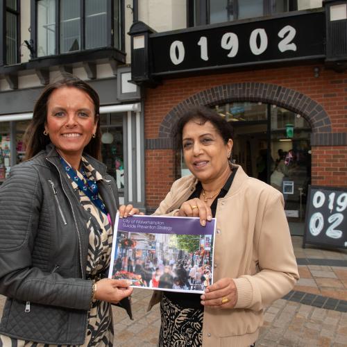 Councillor Jasbir Jaspal, the City of Wolverhampton Council’s Cabinet Member for Adults and Wellbeing, and Clare Dickens MBE, Chair of Wolverhampton’s Suicide Prevention Stakeholder Forum, with a copy of the City of Wolverhampton Suicide Prevention Strategy