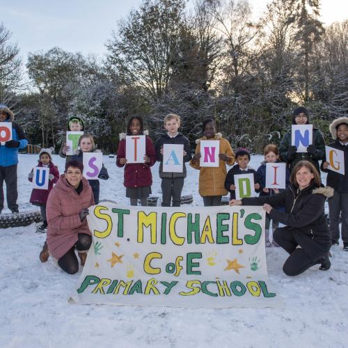 Children from St Michael’s Church of England Aided Primary School celebrate their Outstanding inspection report with Headteacher Kate Jackson and Deputy Headteacher Helen-Marie Navratil