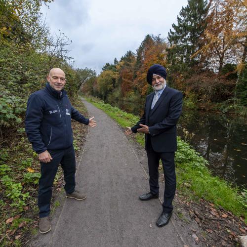 Welcoming visitors to the improved canal towpath at Smestow Valley are Councillor Bhupinder Gakhal, cabinet member for resident services at City of Wolverhampton Council, and Ian Lane, Head of Operational Partnerships and Fundraising at Canal & River Trust